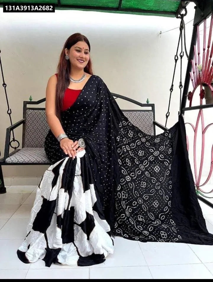 TRENDBUY Chandri Cotton Digital Print Saree in Black, worn by a model sitting on a swing.