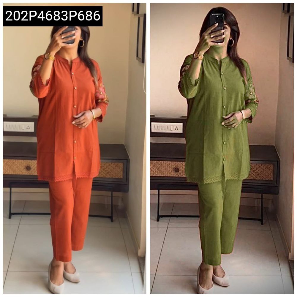 Woman modeling a terracotta orange embroidered cotton slub co-ord set, full body front view.