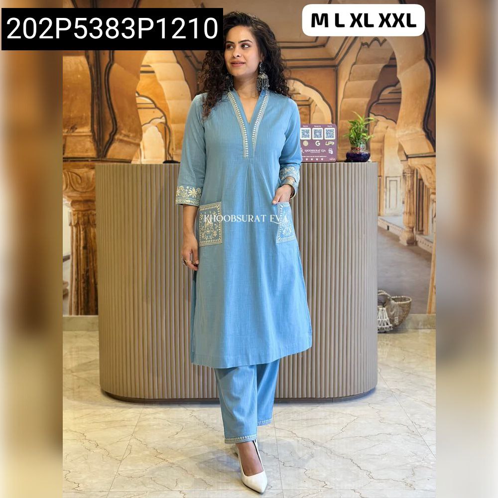 Full body model posing in light blue embroidered slub cotton kurti pant set