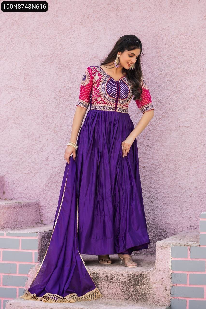 Full-length shot of model in a dazzling Lavender Anarkali Gown with a pink embroidered bodice, posing with dupatta.