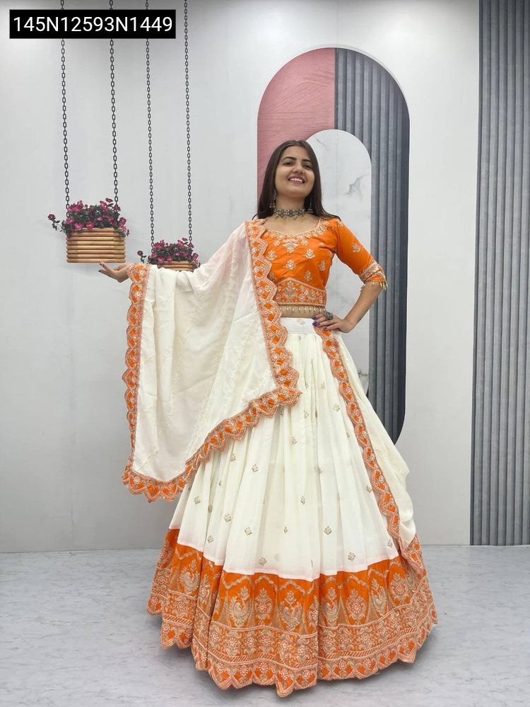 TRENDBUY Chinon Embroidered Lehenga Set: Model presenting the complete look, smiling, featuring the vibrant orange and cream combination.
