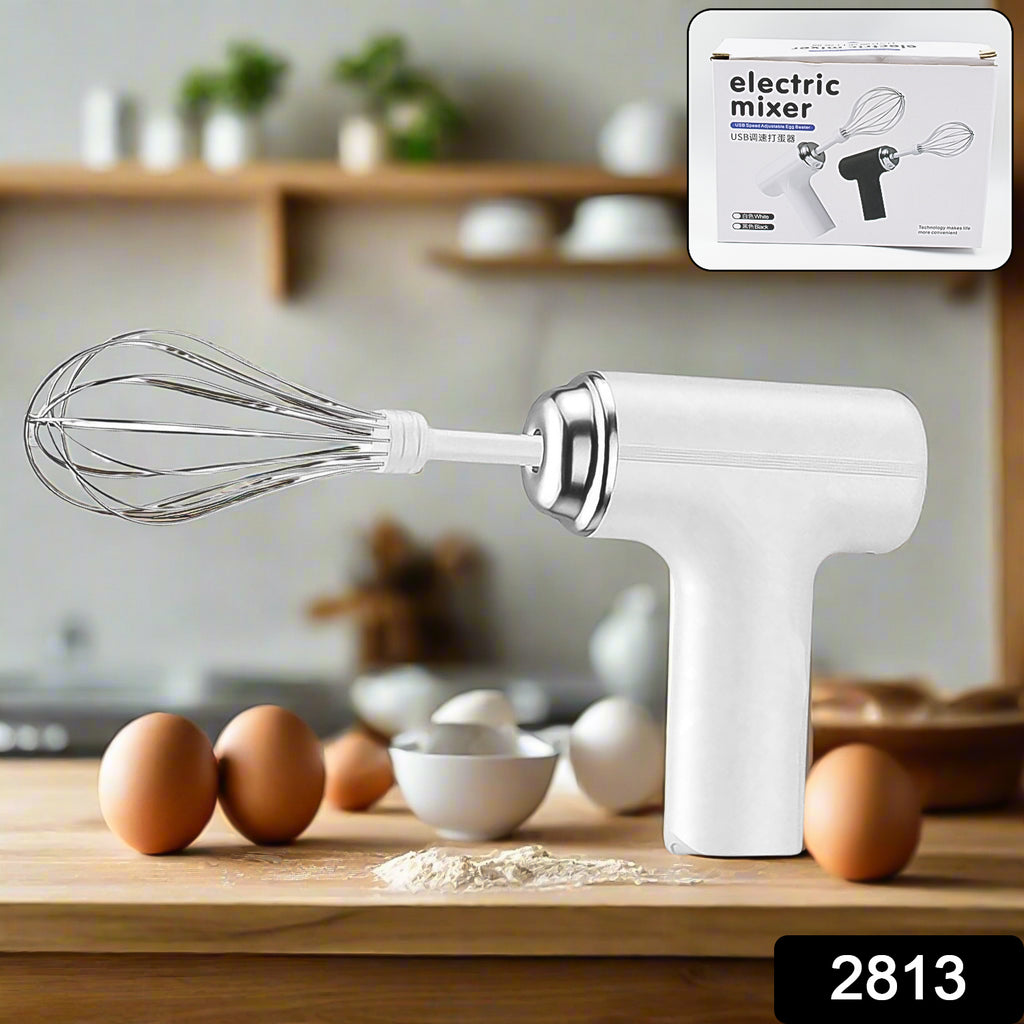 Portable high power wireless hand mixer with whisk attachment mixing baking batter.
