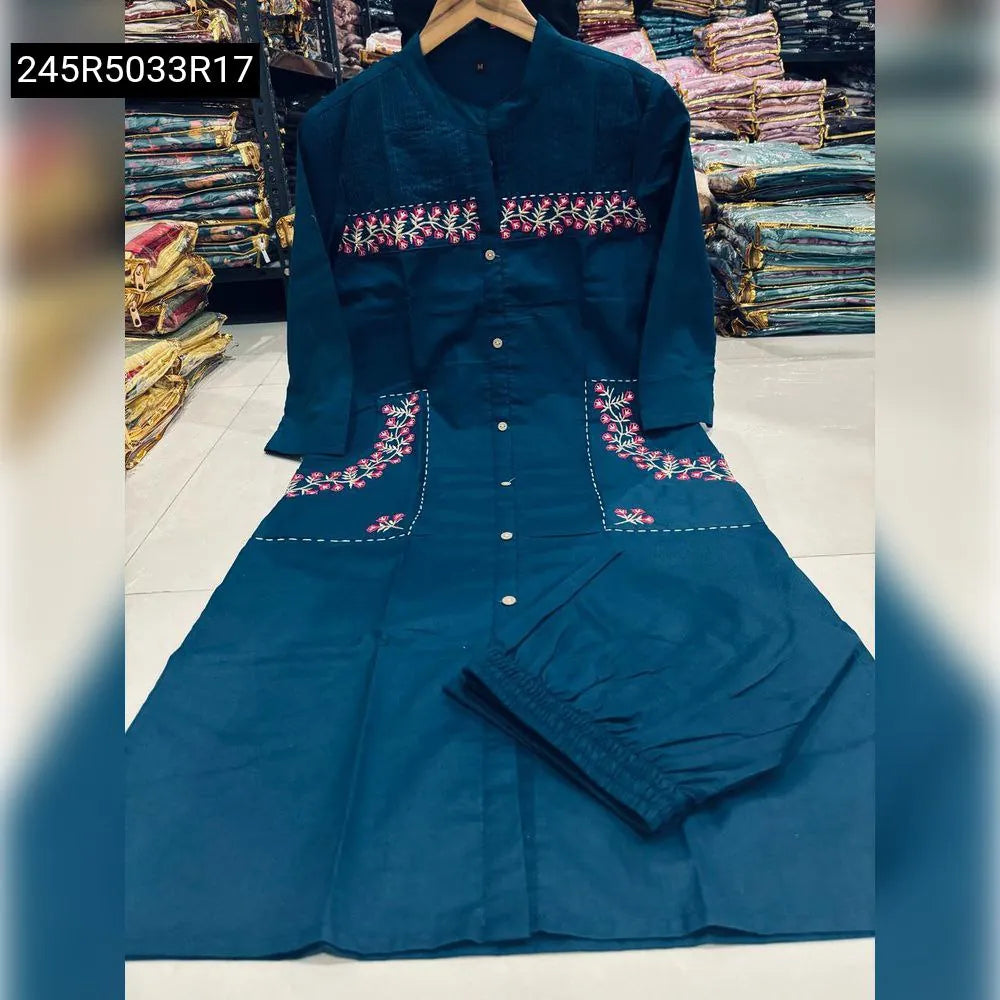 Model wearing TRENDBUY Classy Embroidered Cotton Kurti Set in Teal, front-facing 3/4 view, showcasing the elegant fit and embroidery.