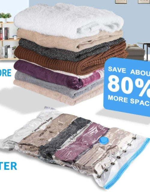 Transparent compression storage bags packed with clothes and bedding, visibly saving space.