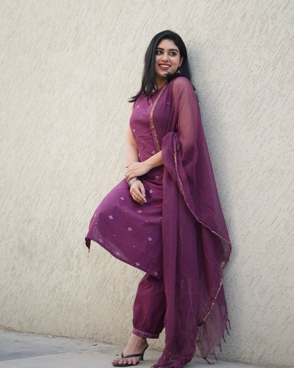 Woman posing in Mulberry Purple Cotton Print Kurti Set with Kotadoriya Dupatta