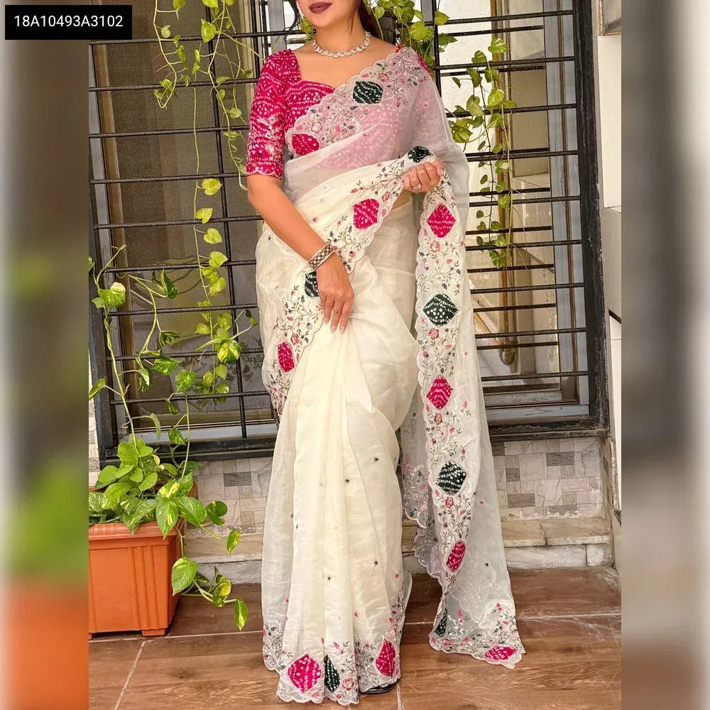 Full-body shot of a model elegantly draped in the off-white crystal tissue saree with a vibrant pink bandhej blouse, standing front-facing.