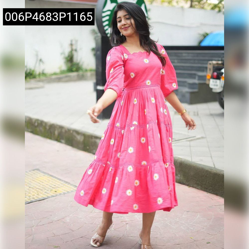 Woman posing gracefully in pink Daisy embroidered maxi dress, full length outdoor