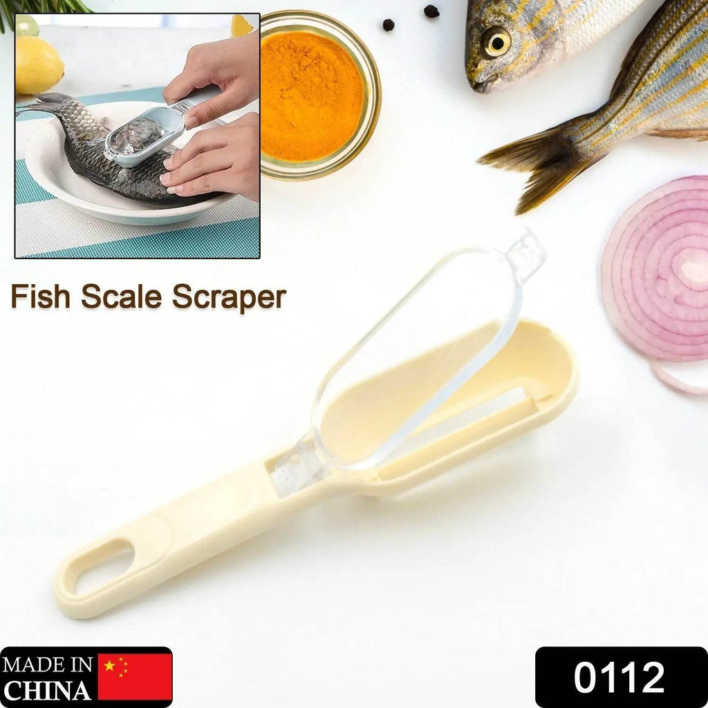 Plastic fish scales scraper and grater device with cover for efficient kitchen fish cleaning.