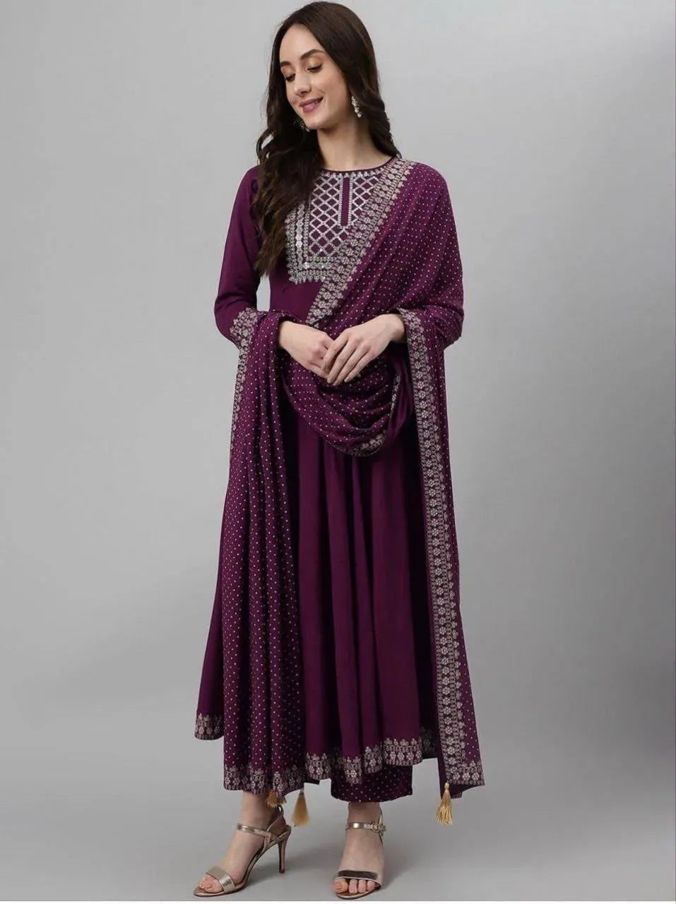 Model standing wearing purple anarkali kurti set with dupatta