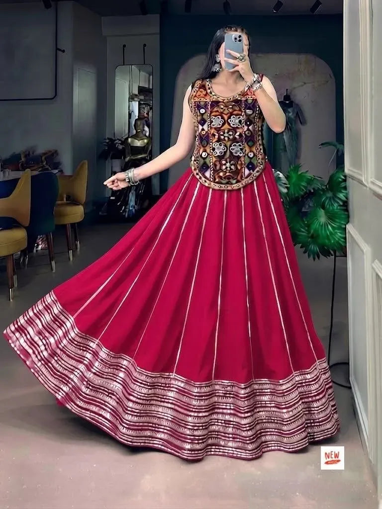 Model wearing pink cotton chaniya choli with heavy mirror work blouse