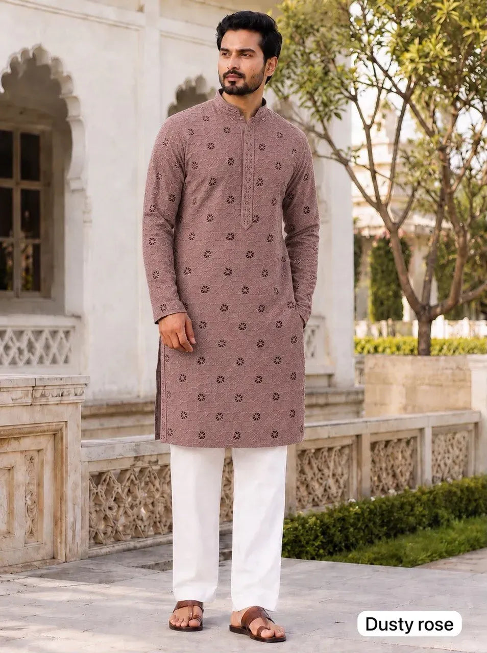 Man wearing dusty rose chikan schiffli kurta with white pyjama outdoors