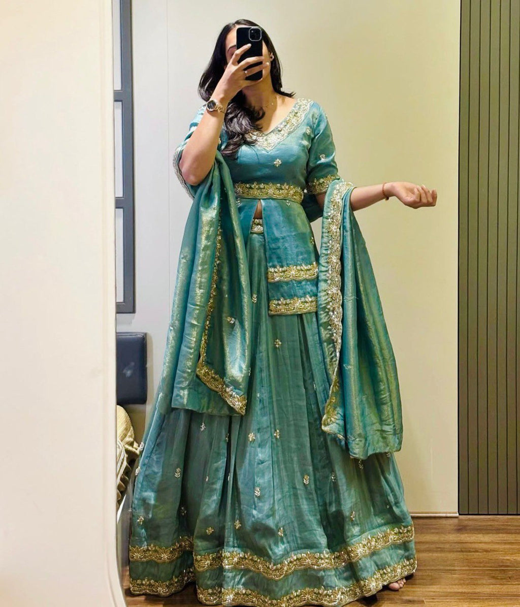 Woman in Sea Green Chinon Silk Lehenga Choli with intricate gold sequence work, full view