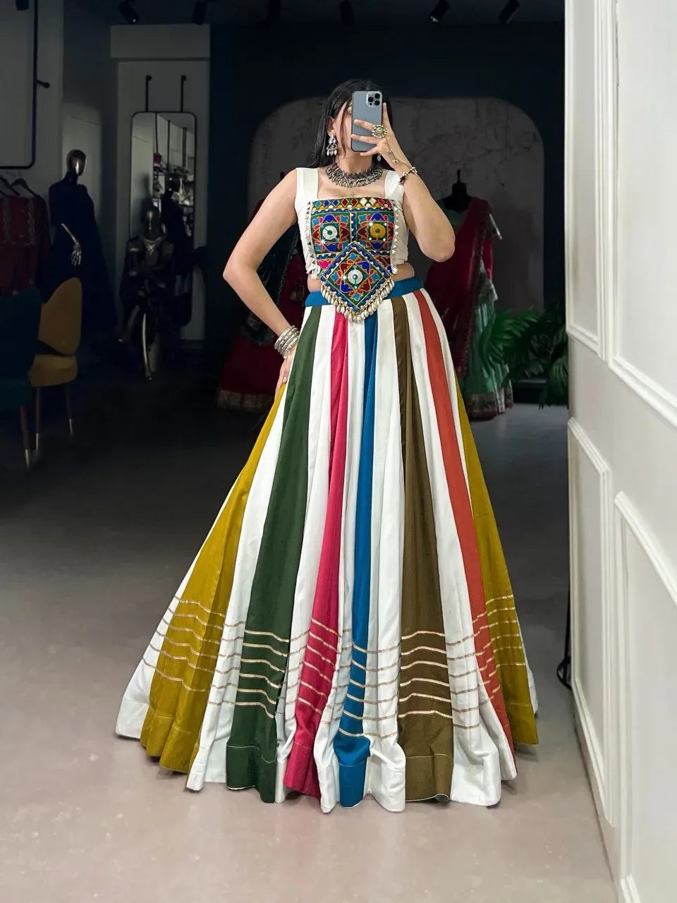 Woman wearing multi-color striped rayon co-ord lehenga with mirror work blouse