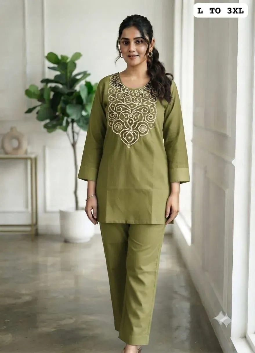 Model wearing olive green cotton co-ord set with embroidery
