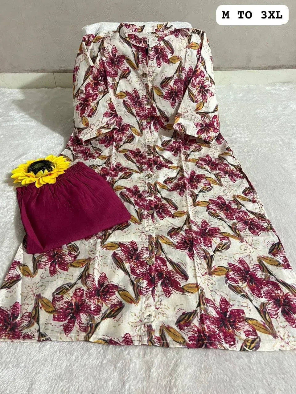 White and maroon floral printed A-line top with matching pants and yellow sunflower