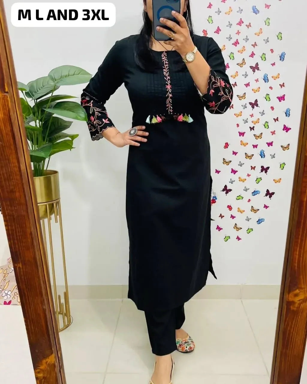 Full body shot of model wearing black cotton cord set