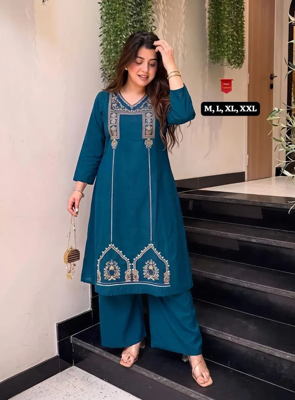 Model wearing teal blue cotton kurti palazzo set with embroidery