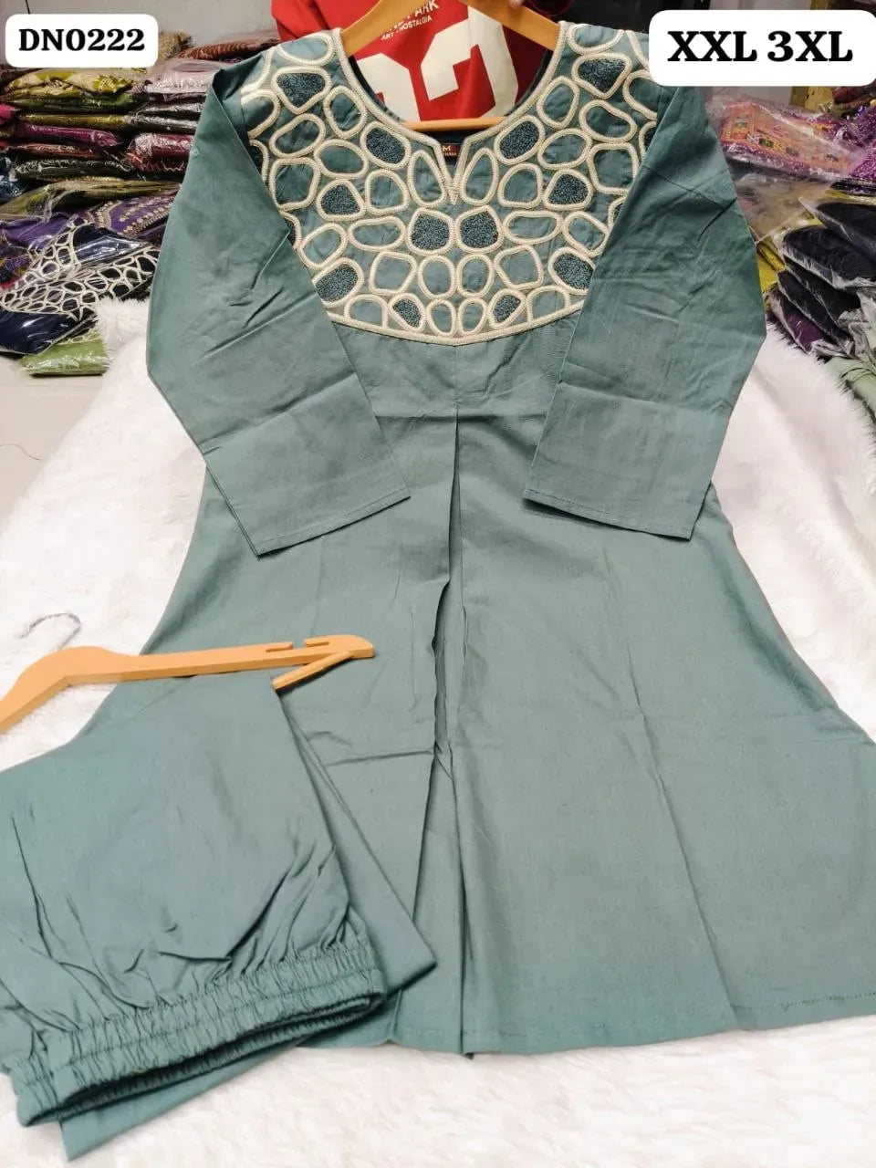 Sage green dabhu cotton cord set with intricate thread work on neckline