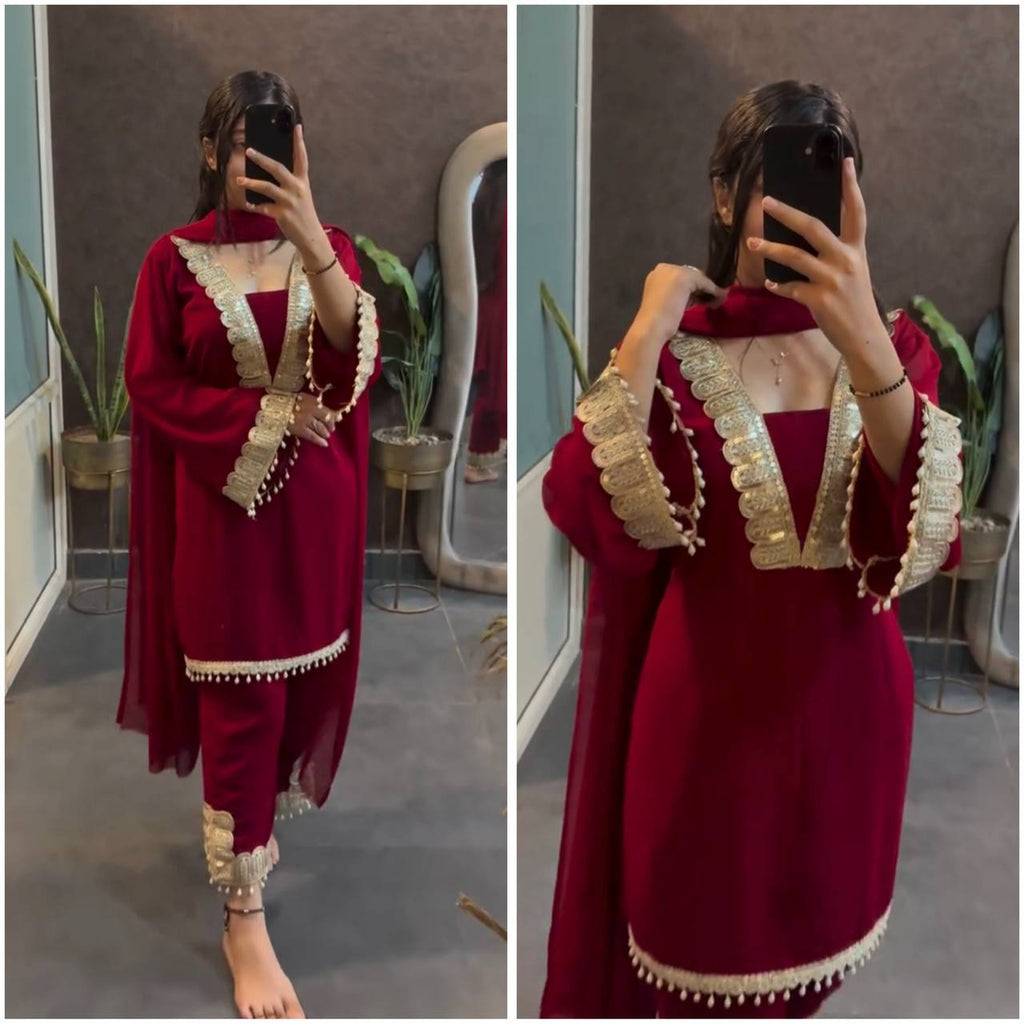 Model wearing full maroon embroidered georgette suit set, front view