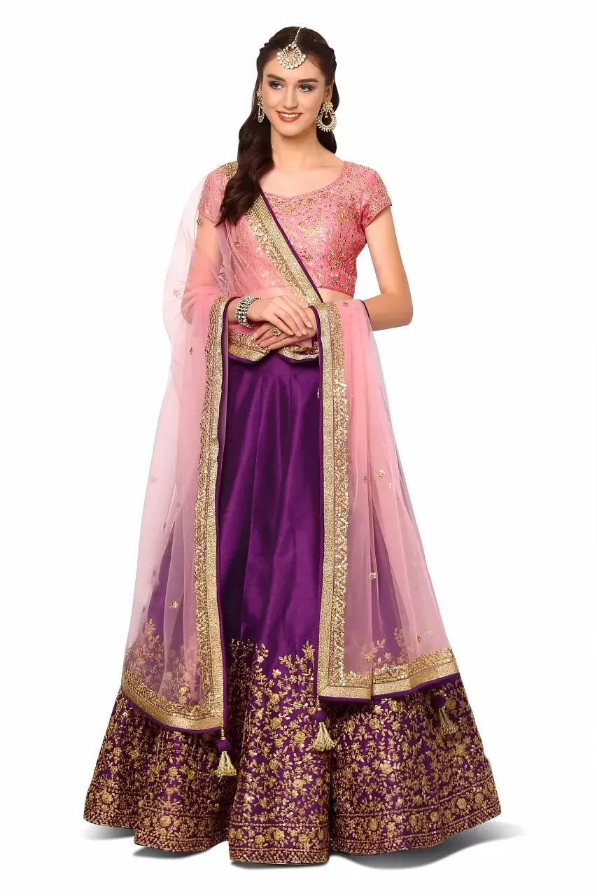Model wearing royal purple lehenga with pink embroidered blouse and dupatta