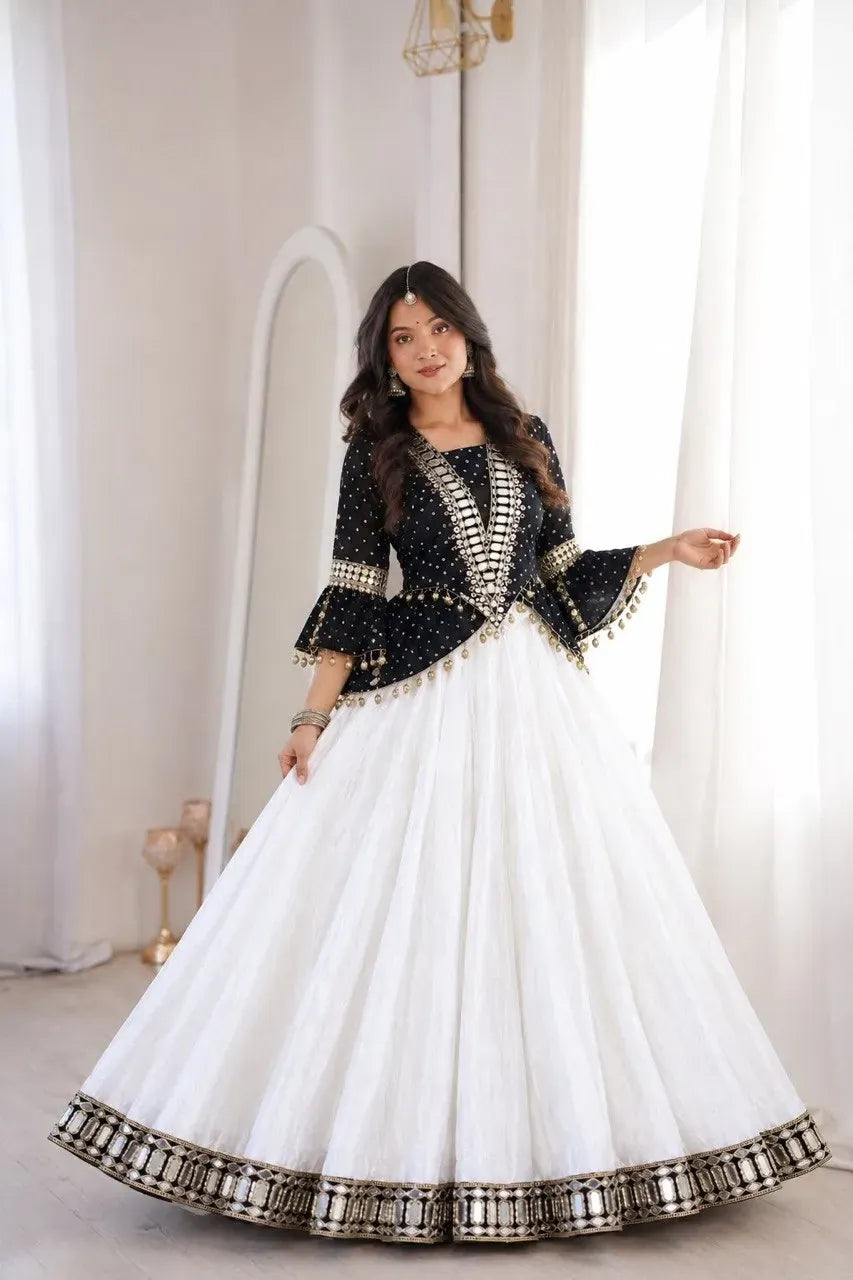 Woman wearing black and white designer kurti with chinon lehenga