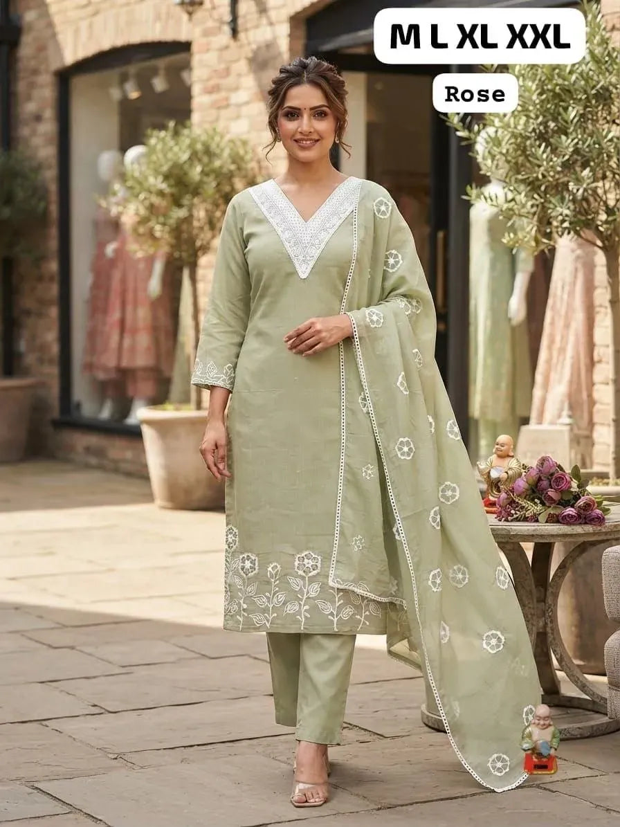 Model wearing sage green roman silk suit set with white floral embroidery