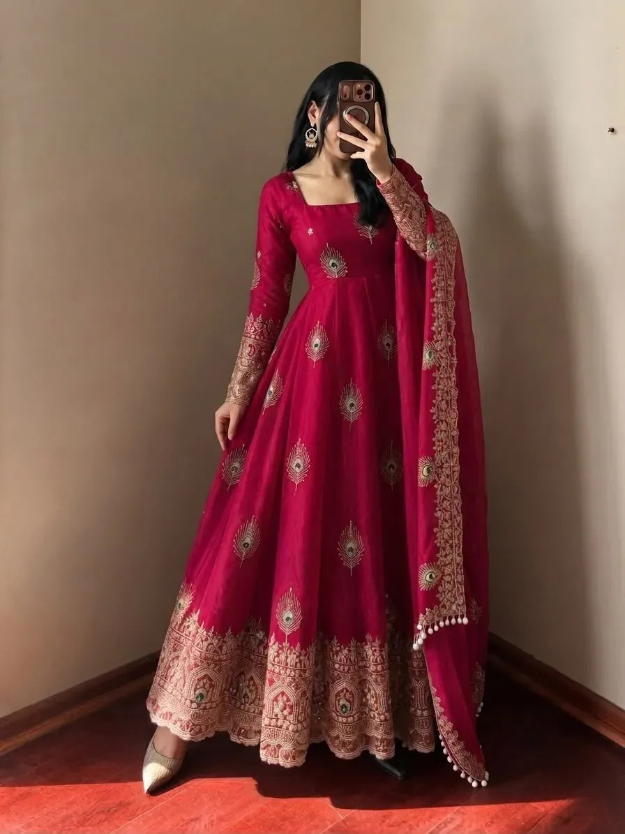 Model wearing pink fendy silk gown with heavy sequence embroidery and dupatta