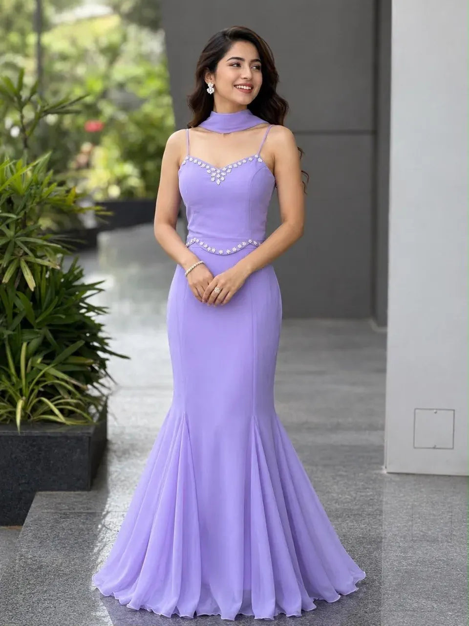 Woman wearing lavender georgette fishcut skirt and padded blouse set