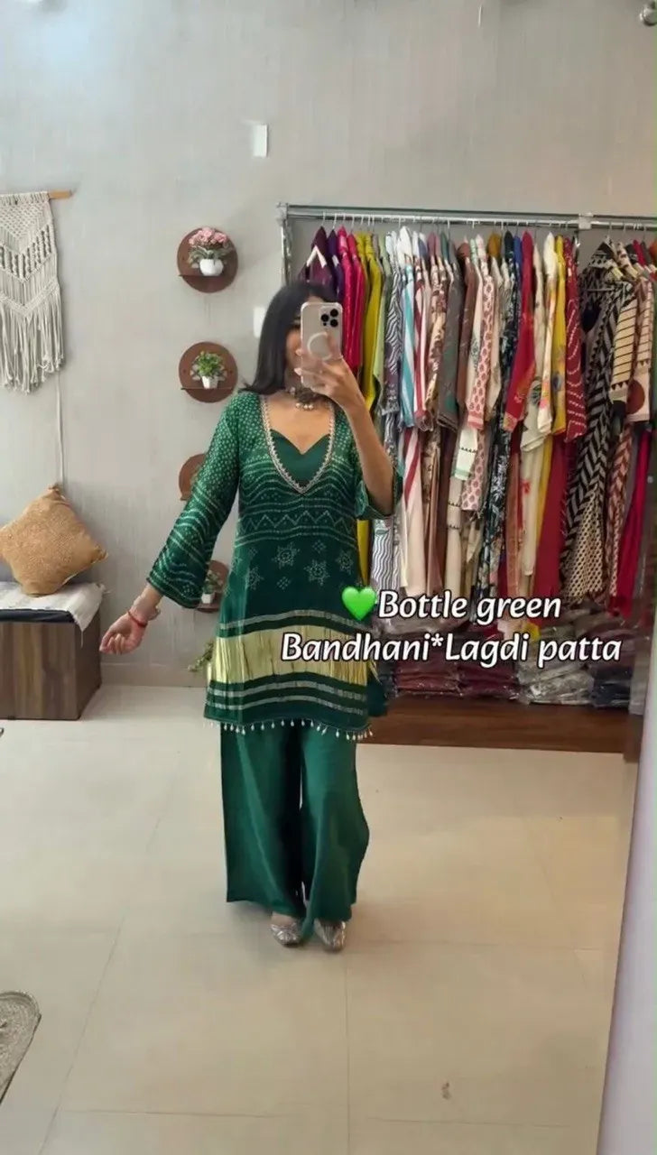 Model wearing bottle green georgette bandhani cord set with lagdi patta