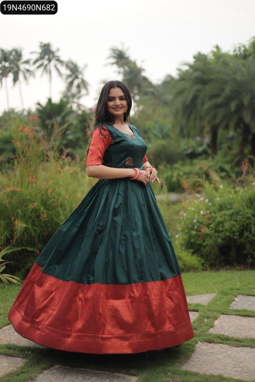 Model posing in a radiant green Banarasi Jacquard Silk Gown, showcasing the rich texture and design in a garden setting.