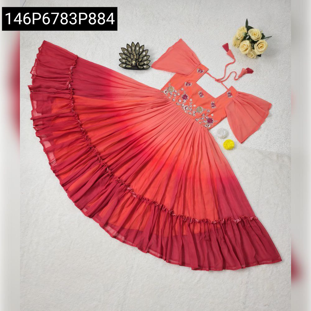 Flat lay of a beautiful red and orange ombre designer midi dress with intricate hand embroidery.