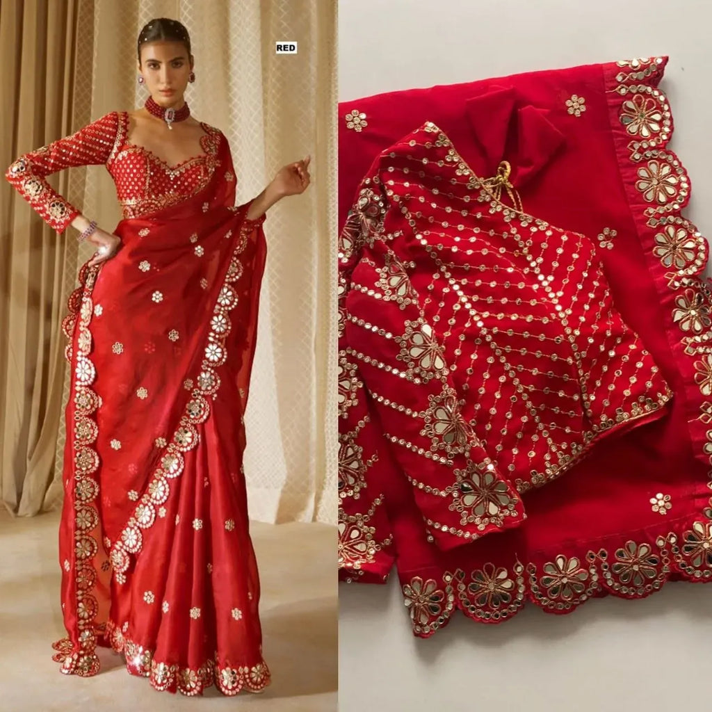Model wearing red faux georgette saree with embroidered blouse and mirror work