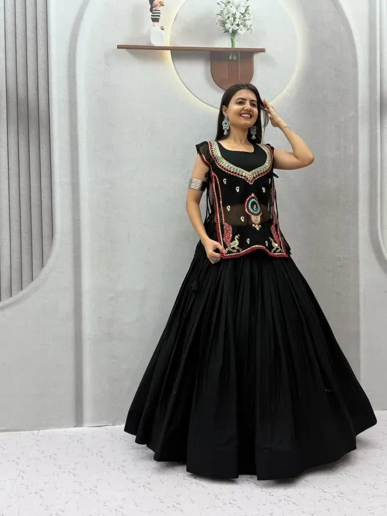 Full length view of model showcasing black festive lehenga and shrug set