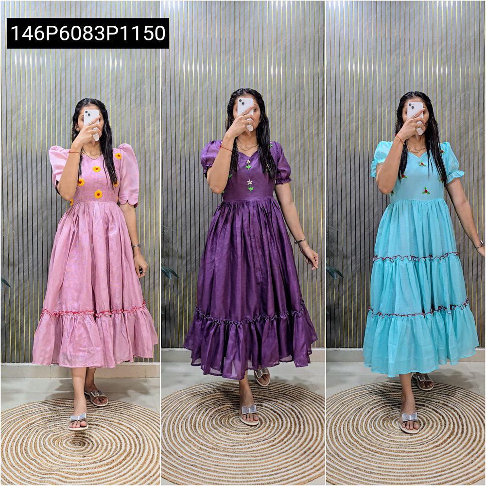 Three models showcasing Blush Pink, Regal Purple, and Sky Blue Kota Check Silk Hand Work Gowns.