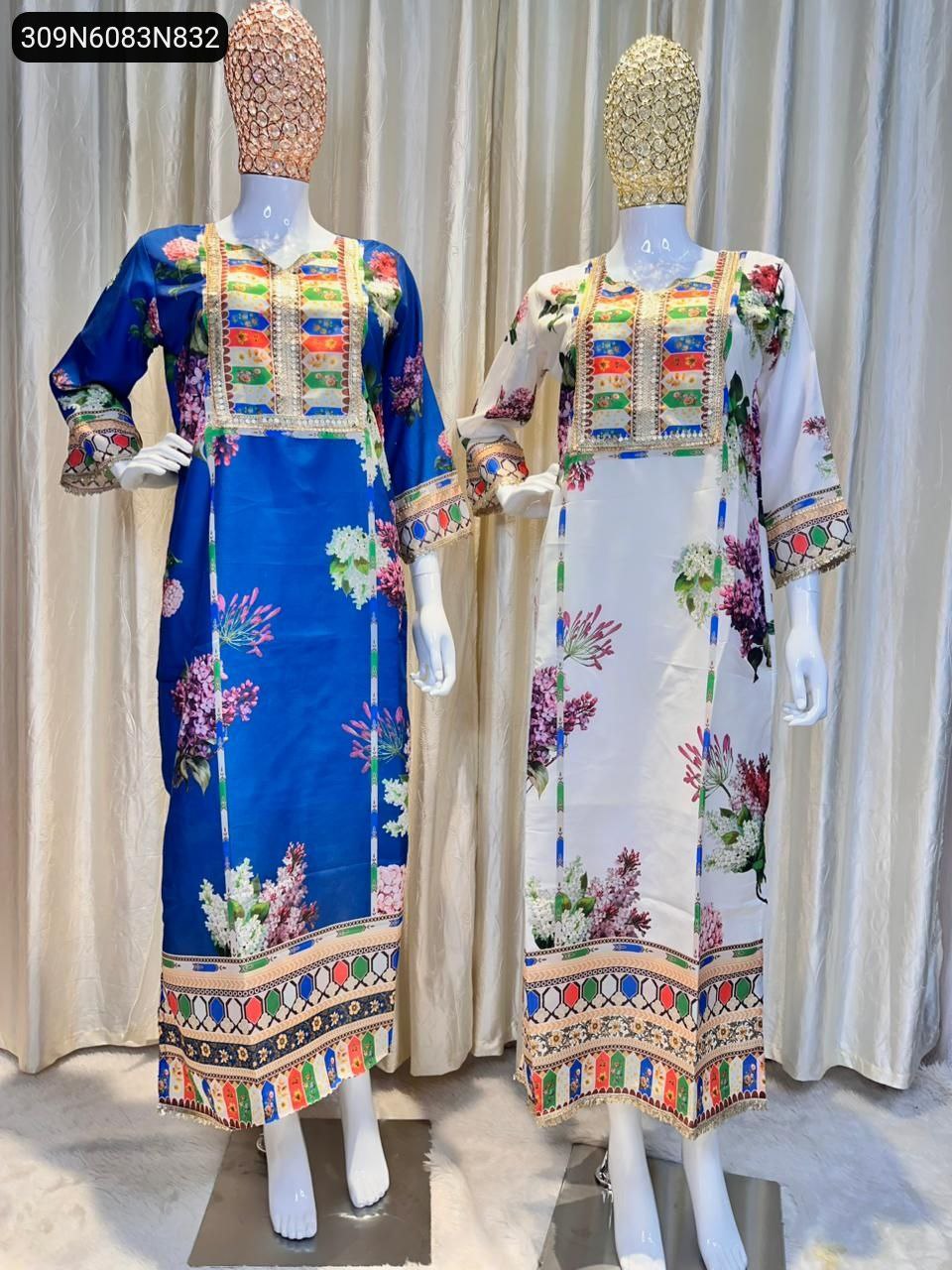 Two mannequins showcasing a Royal Blue and a Cream floral print Muslin dress with colorful embroidery and side slits, ideal for festive wear.