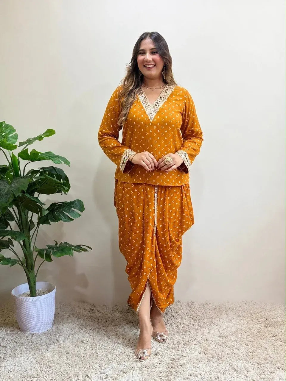 Model wearing mustard yellow muslin silk dhoti cord set with mirror work