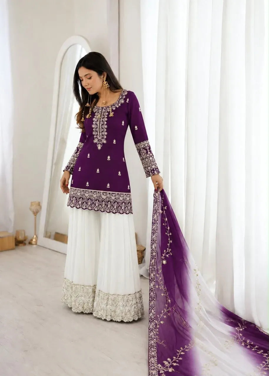 Model wearing purple silk top and white palazzo with embroidered dupatta