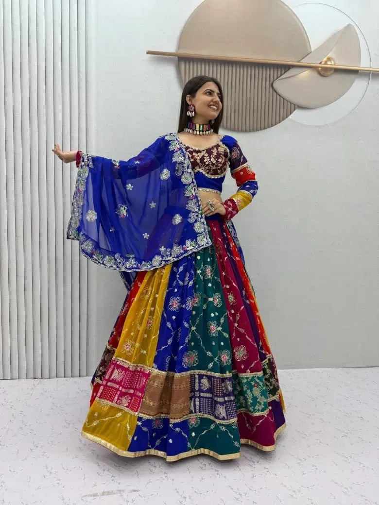 Model wearing multi-color patch work lehenga choli with blue dupatta