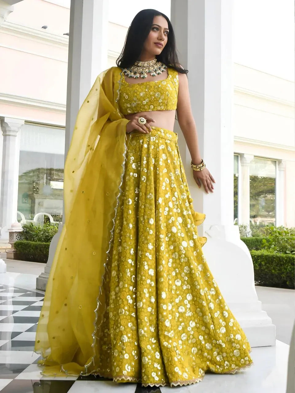 Model wearing olive gold floral sparkle lehenga front view