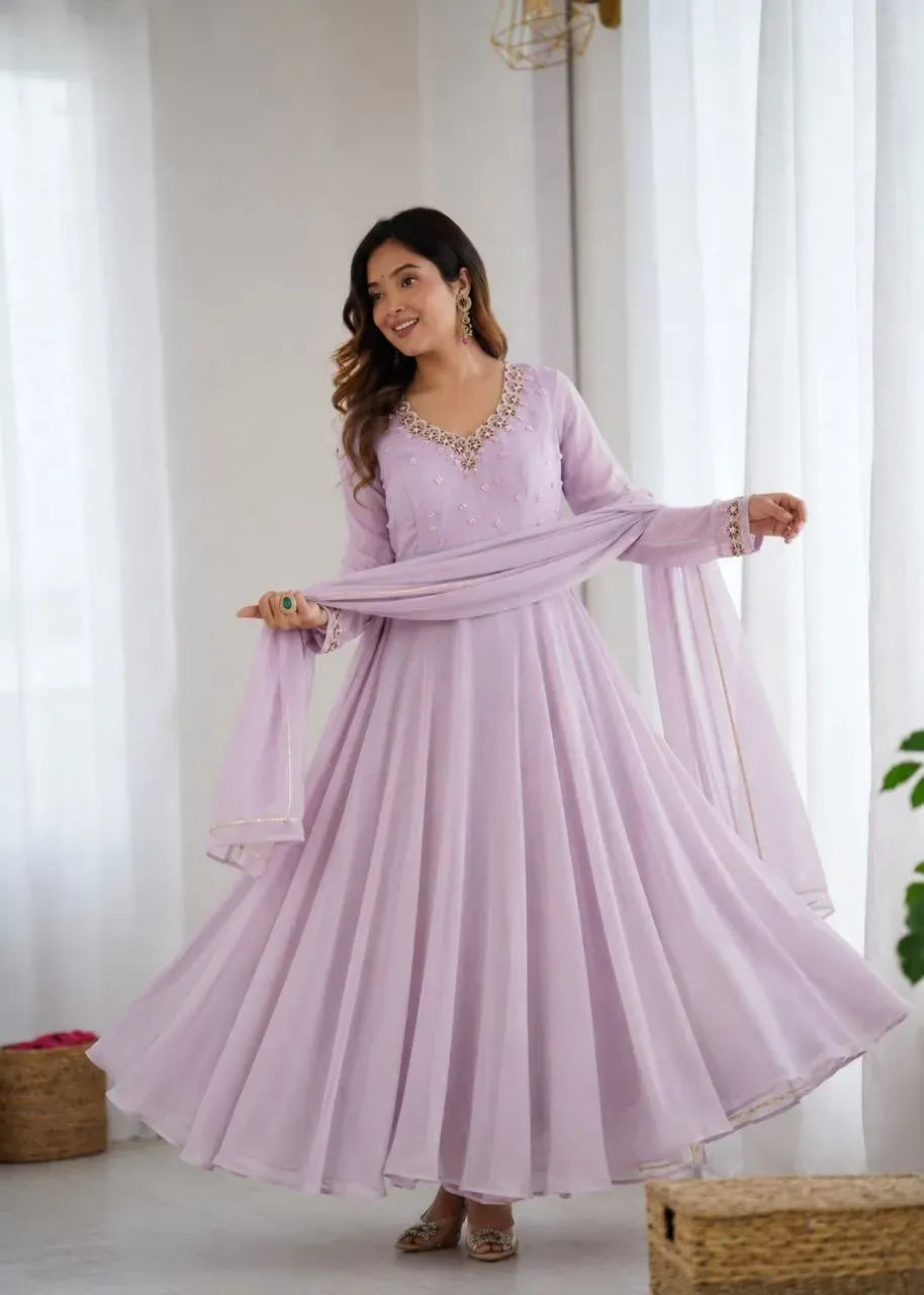 Model wearing lavender fox georgette gown with heavy flair and dupatta