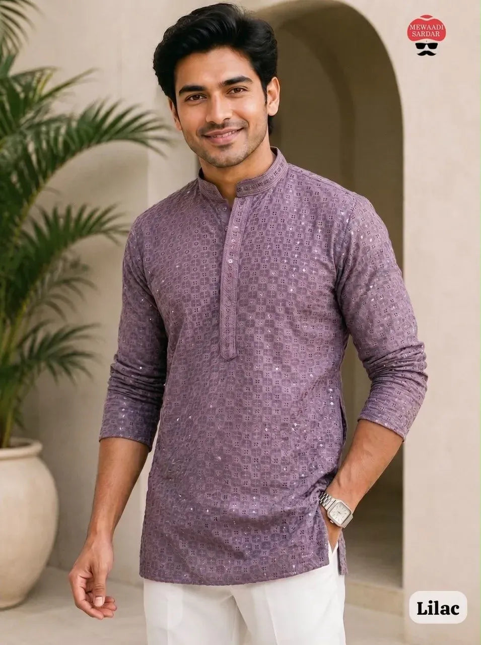 Man wearing lilac rayon chikan work short kurta with white trousers