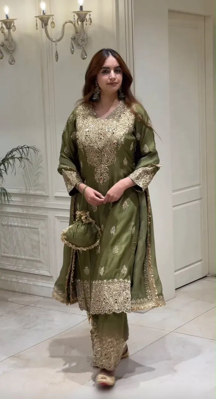 Front view of model displaying the embroidered silk suit and dupatta