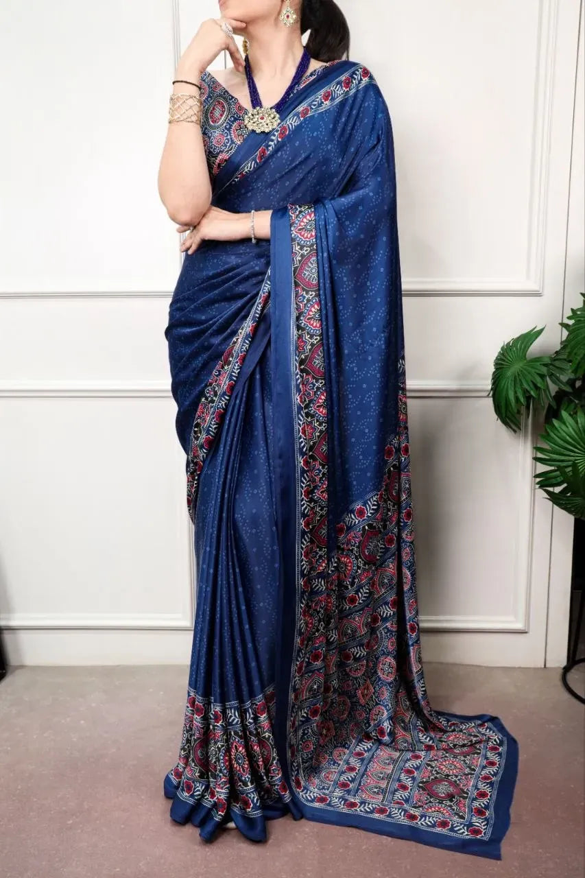 Model wearing blue satin silk saree with Ajrakh print