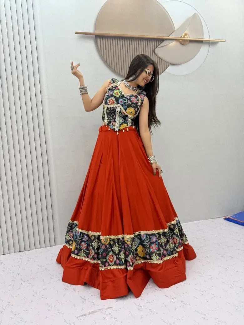 Full body shot of model standing in red and black mirror work lehenga