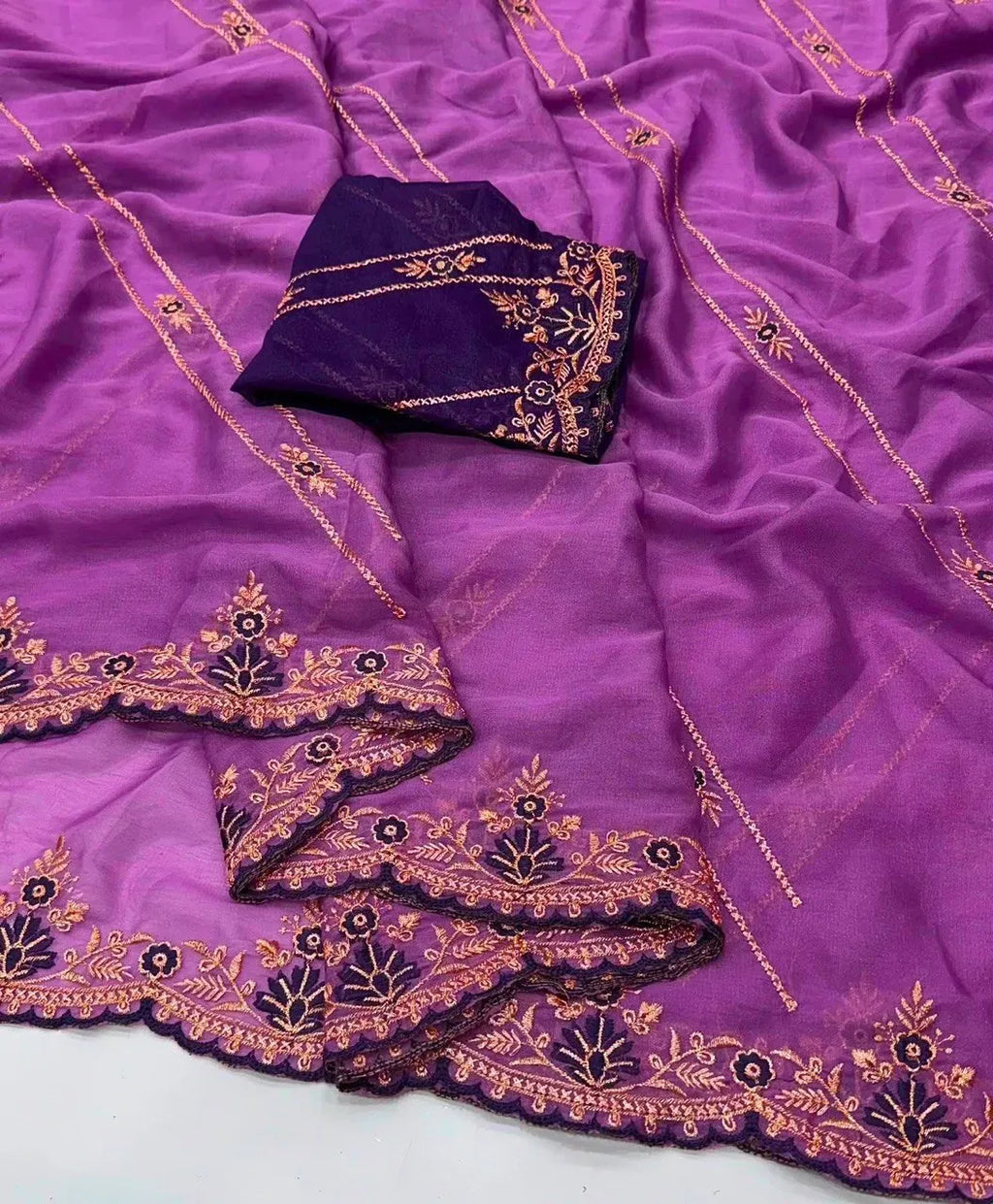 Purple star georgette saree with intricate multi embroidery and dark purple blouse piece