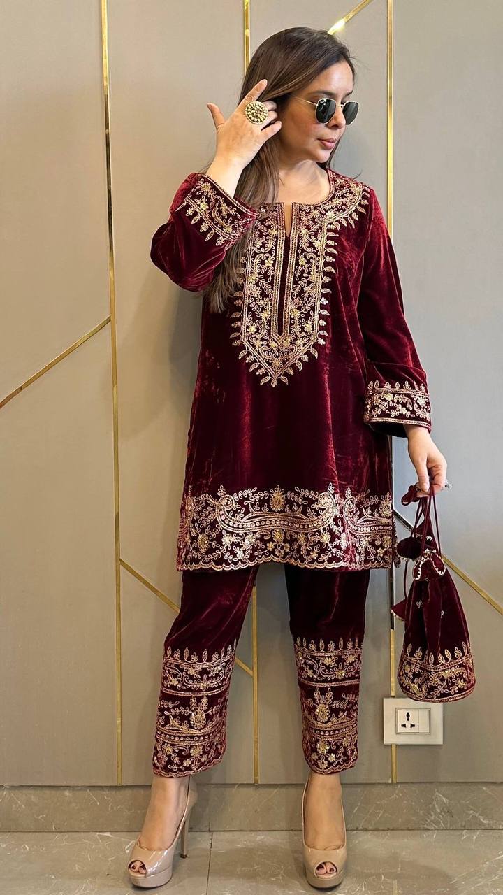 Women's Wine Velvet Kurti Pant Set with Zari Embroidery, Model wearing sunglasses holding potli bag