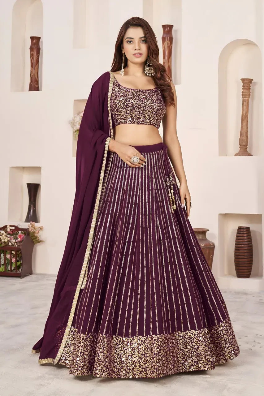 Model wearing wine sequins lehenga choli with dupatta front view