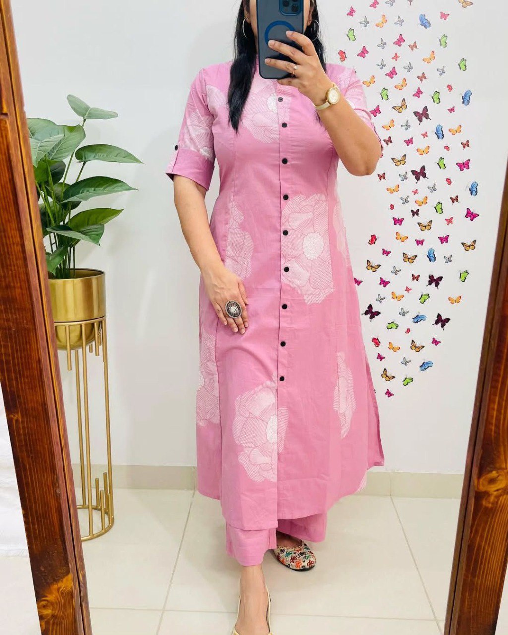 Woman wearing rose pink A-line digital print kurti and pant set