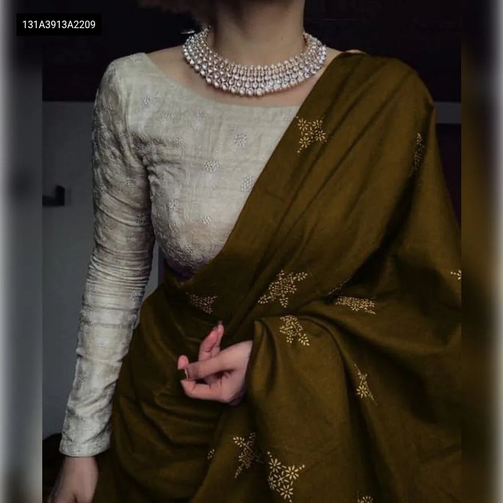 Elegant Olive Green Chanderi Cotton Saree with Digital Print worn by a model, paired with an embroidered boat-neck blouse and statement necklace.