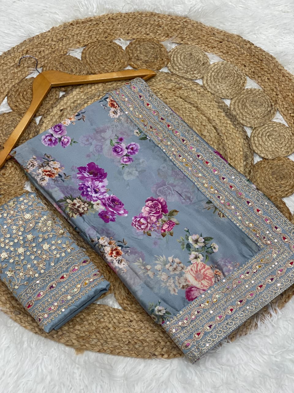 Close-up of the intricate floral digital print on soft lavender silk fabric